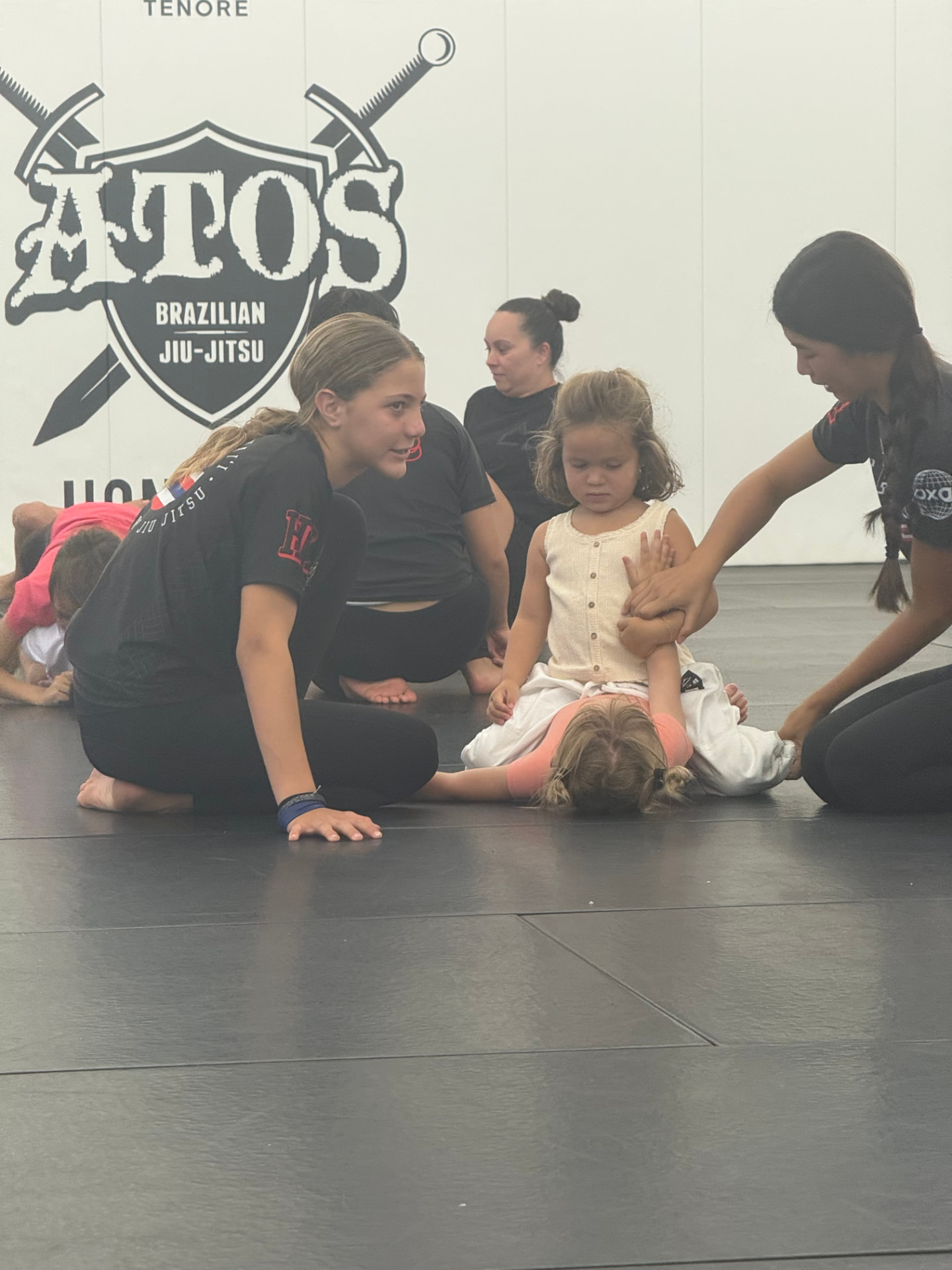Junior coaches working with the smallest students