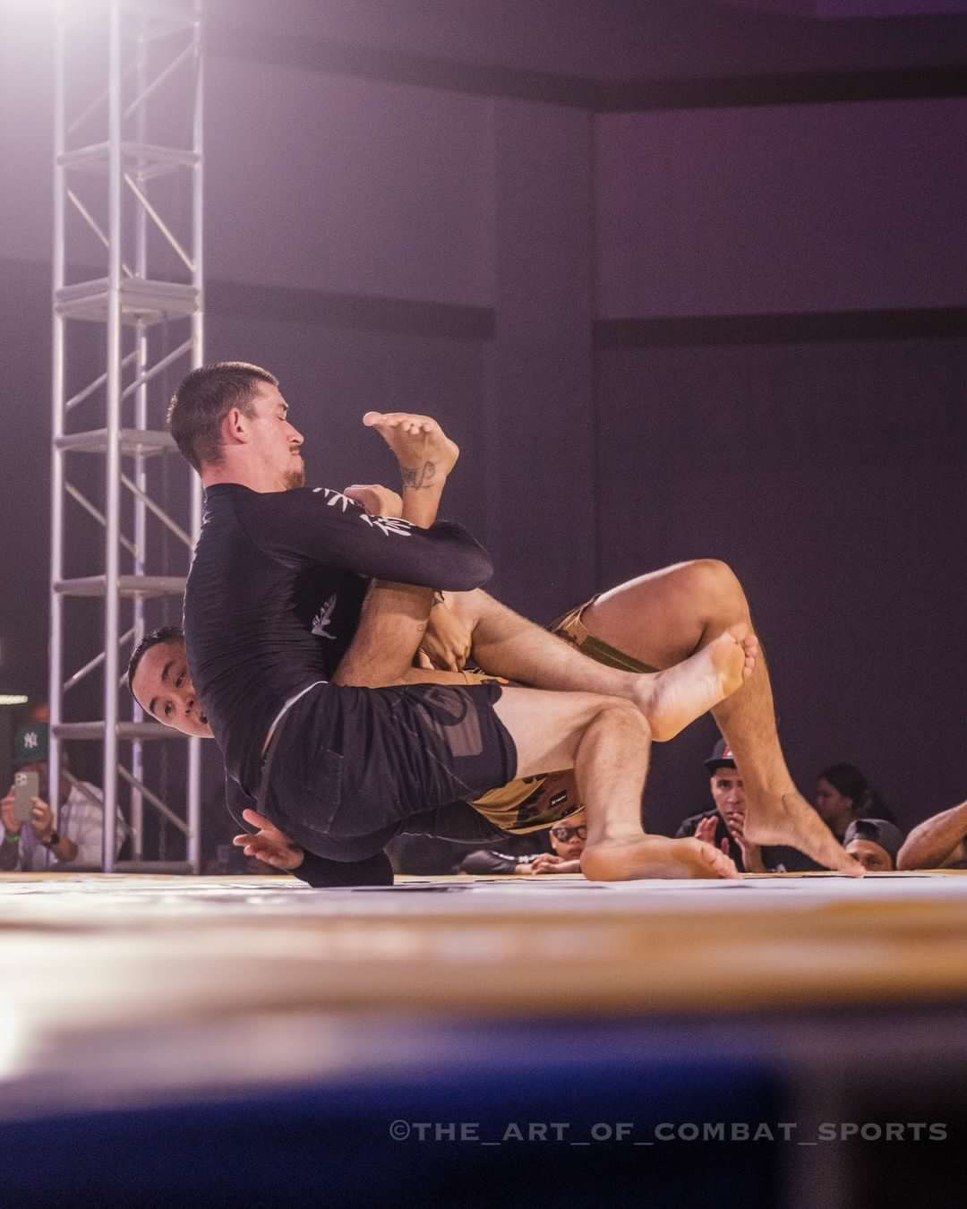 Island Jiu-Jitsu competitor attacking a leg lock during a no-gi grappling match